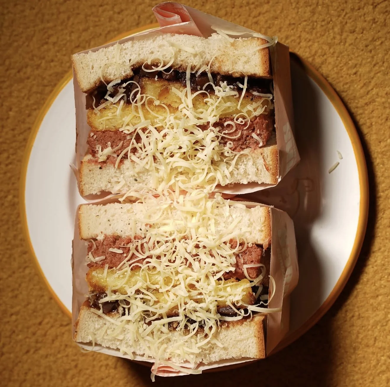 A cheese and pickle sandwich from Sabins