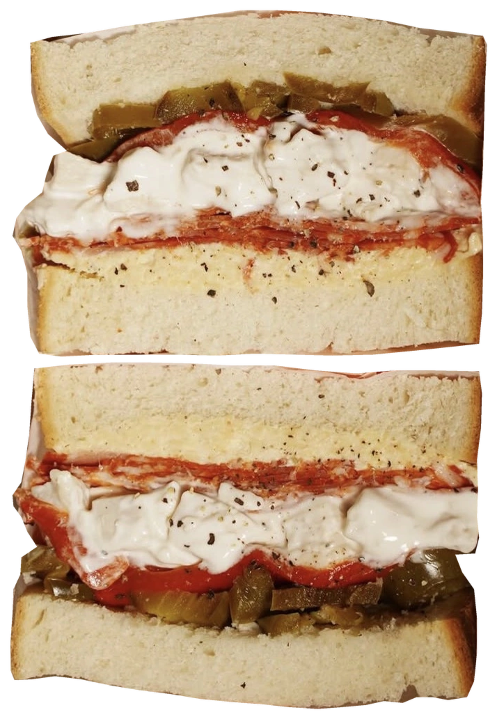 A real Sabins sandwich, cut in half and generously filled