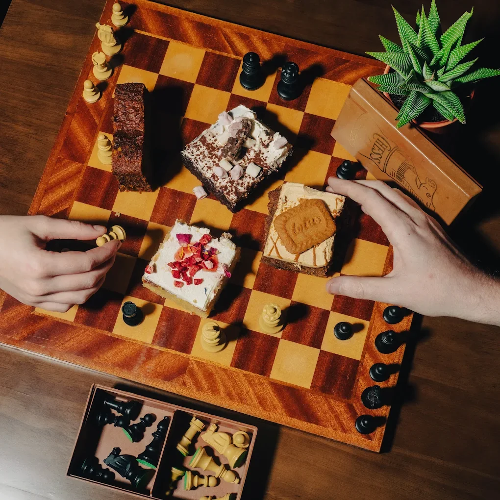 Coffee and a game of chess at a Sabins table